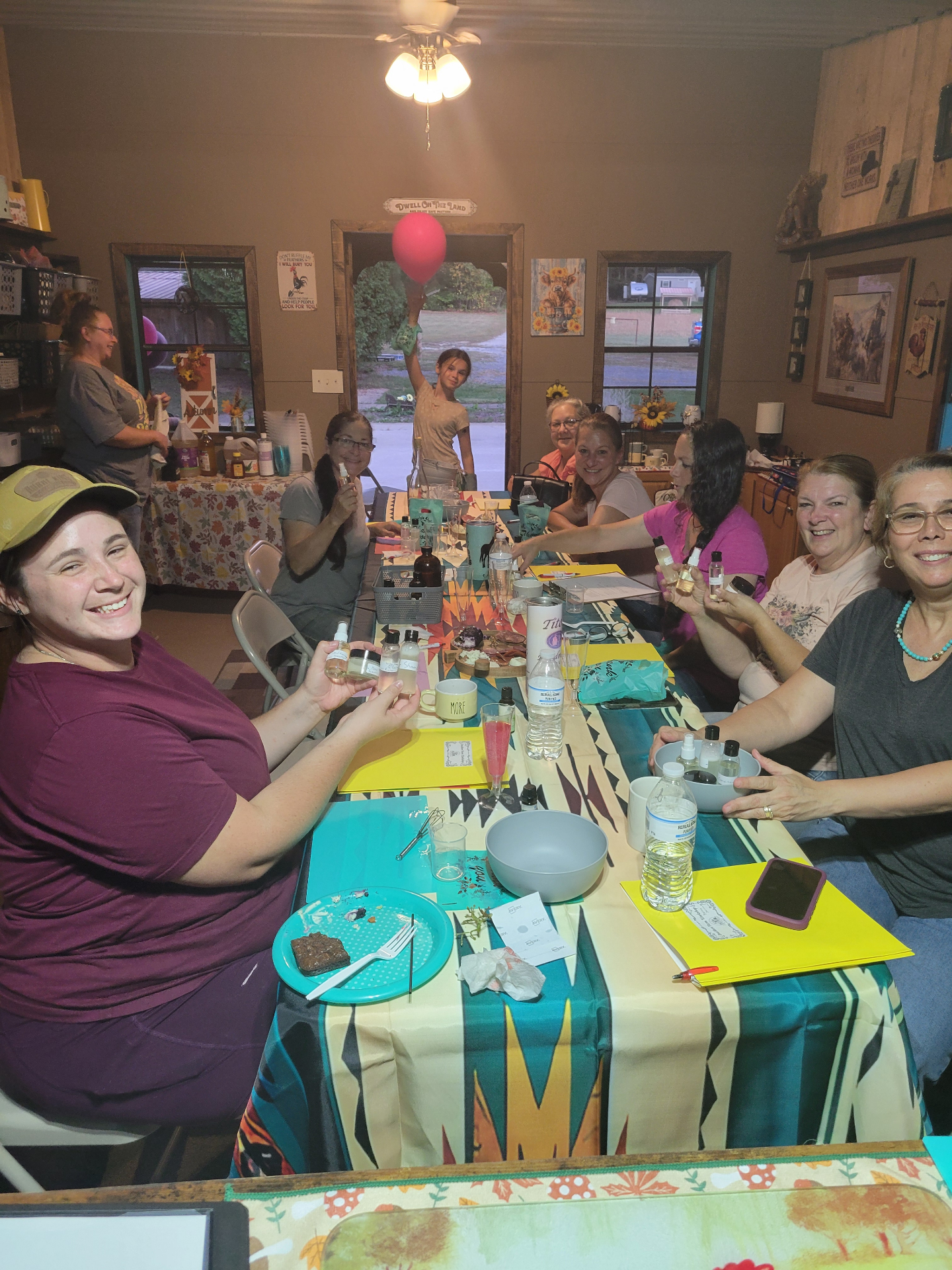 Workshop guests holding their handmade products